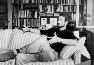 A 1991 photo of William Dendy with books from his library.