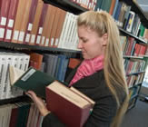 Picture of a women in the reference collection at the Dana Porter Library