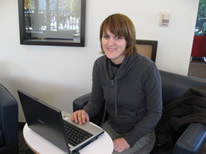 Woman using her laptop in the Dana Porter Library